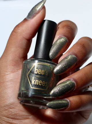 Image provided for Bee's Knees by a paid swatcher featuring the nail polish " Denial "