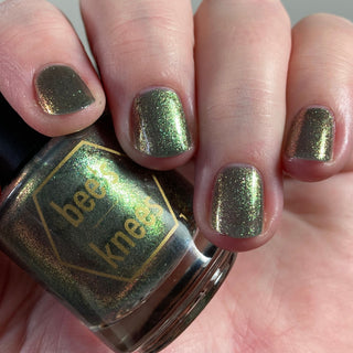 Image provided for Bee's Knees by a paid swatcher featuring the nail polish " Denial "